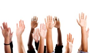 voting hands raised